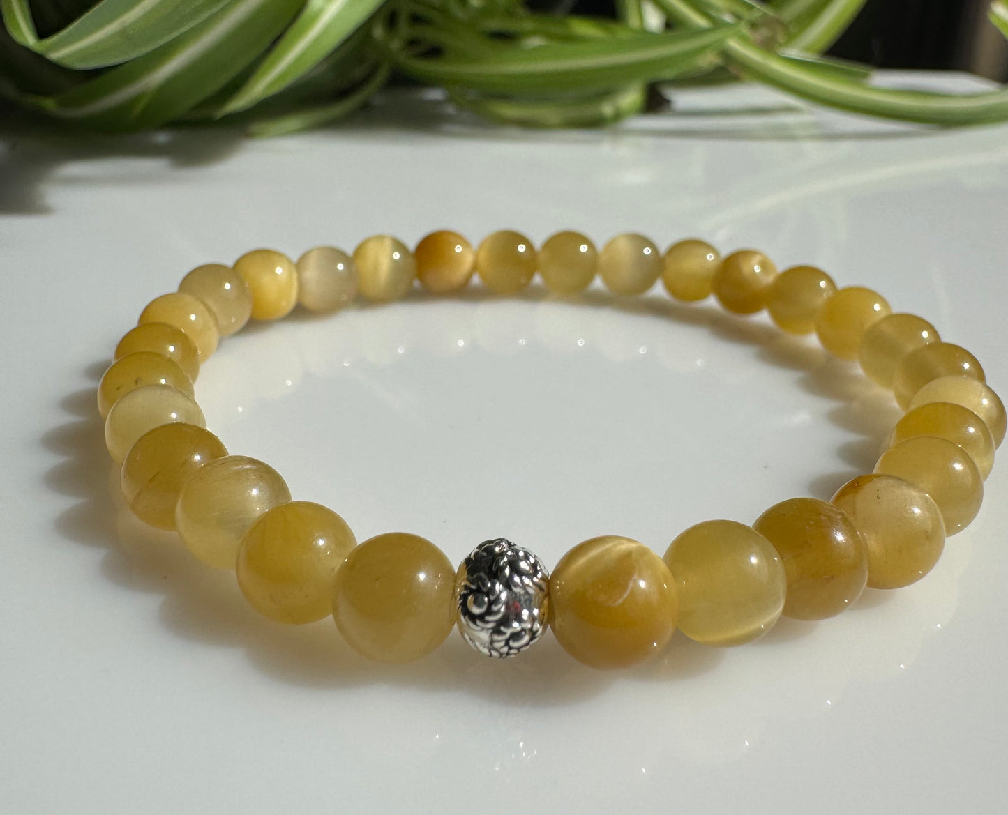 Cat's Eye Chrysoberyl 6mm Gemstone Minimalistic Stretchy Bracelet with a Flower Silver Bead. Gift for Her. Gift for Him.