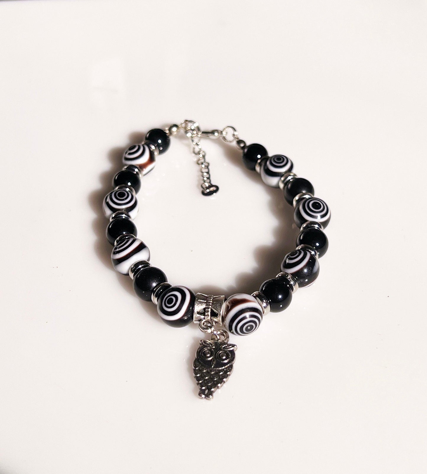 Eye Agate and Onyx Bracelet - Round Eye Agate and Onyx beaded bracelet with dangling silver owl.