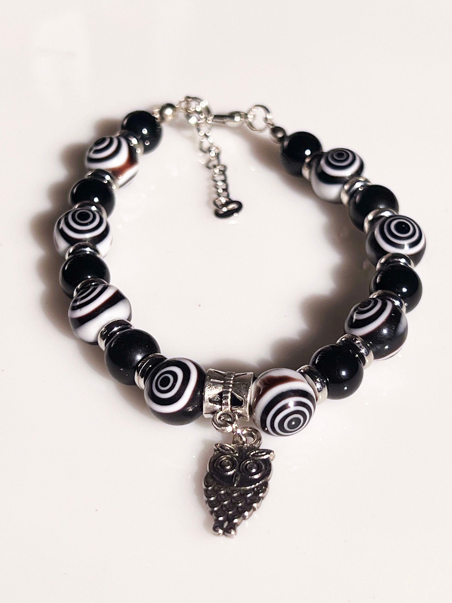 Eye Agate and Onyx Bracelet - Round Eye Agate and Onyx beaded bracelet with dangling silver owl.