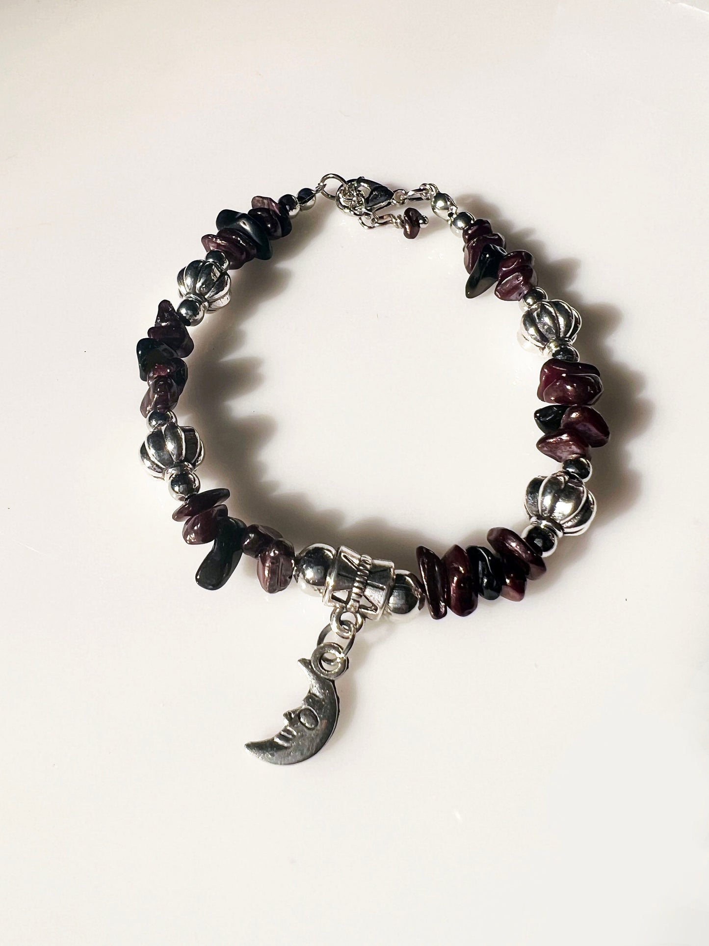 Almandine and Black Onyx Gemstone Bracelet - Almandine and Black Onyx Gemstone bracelet with silver spacers and hanging moon charm.