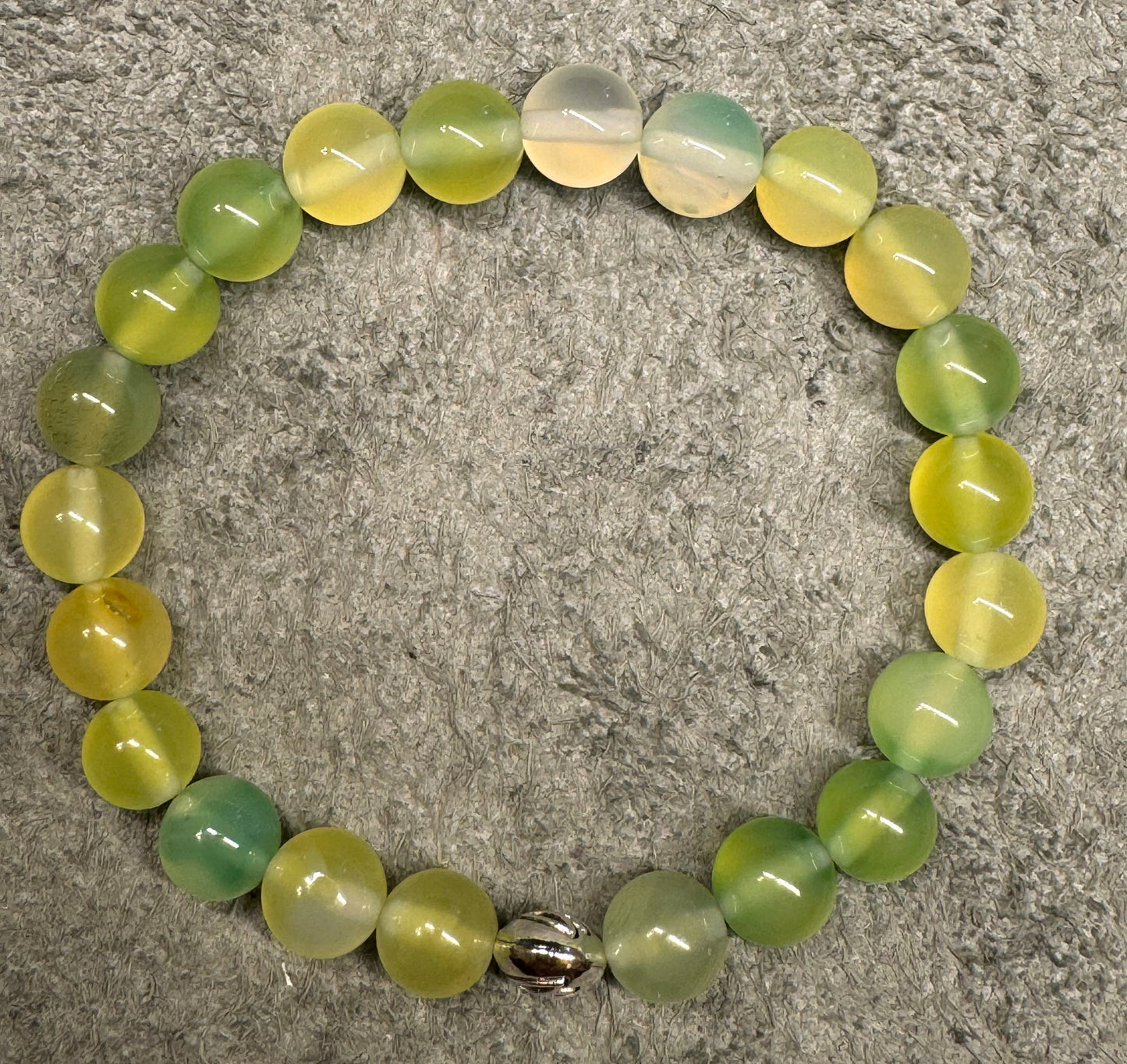 8mm Prehnite Gemstone Stretchy Bracelet with a Lotus Silver Bead.