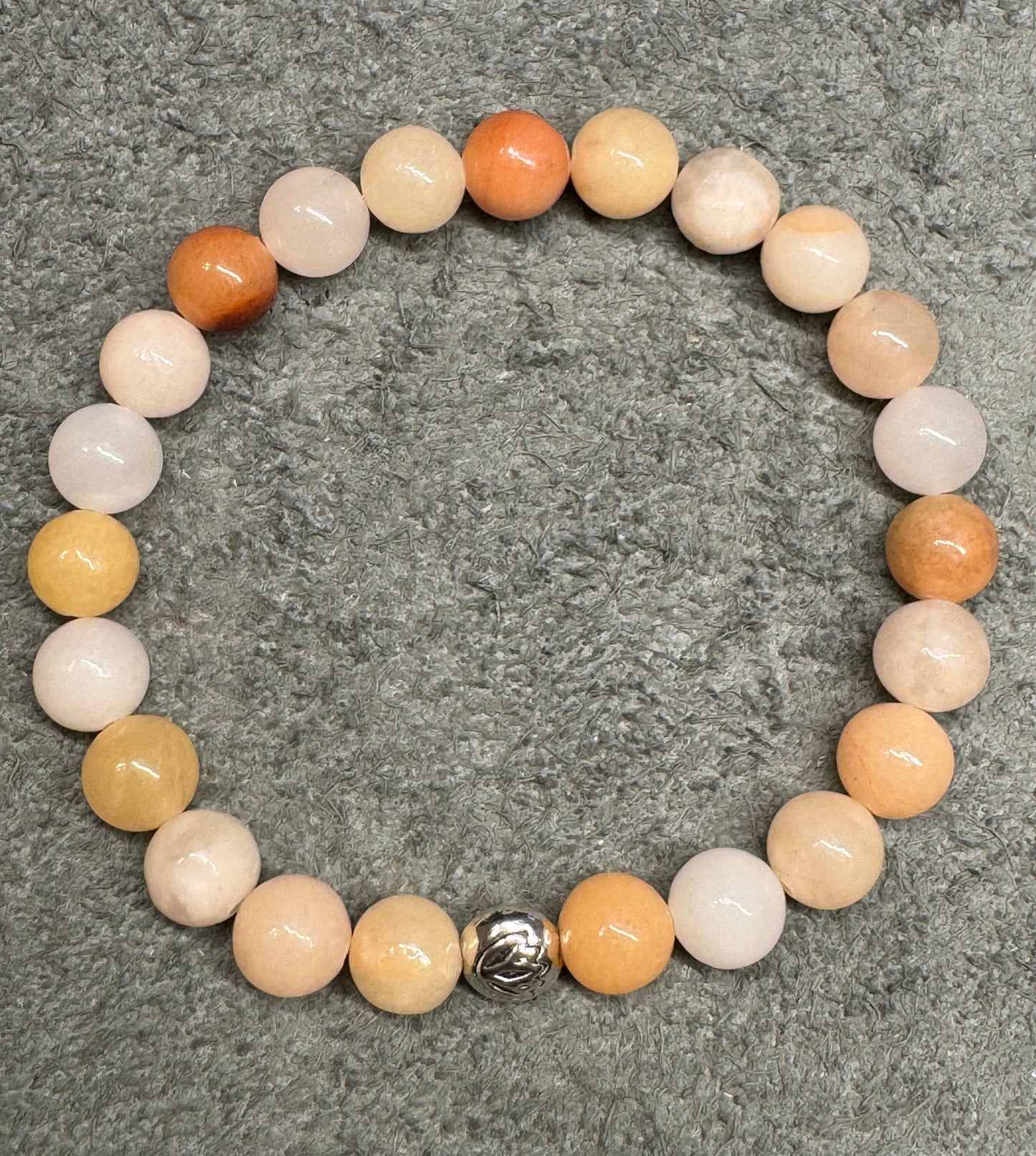 8mm Peach Aventurine Gemstone Stretchy Bracelet with a Lotus Silver Bead.