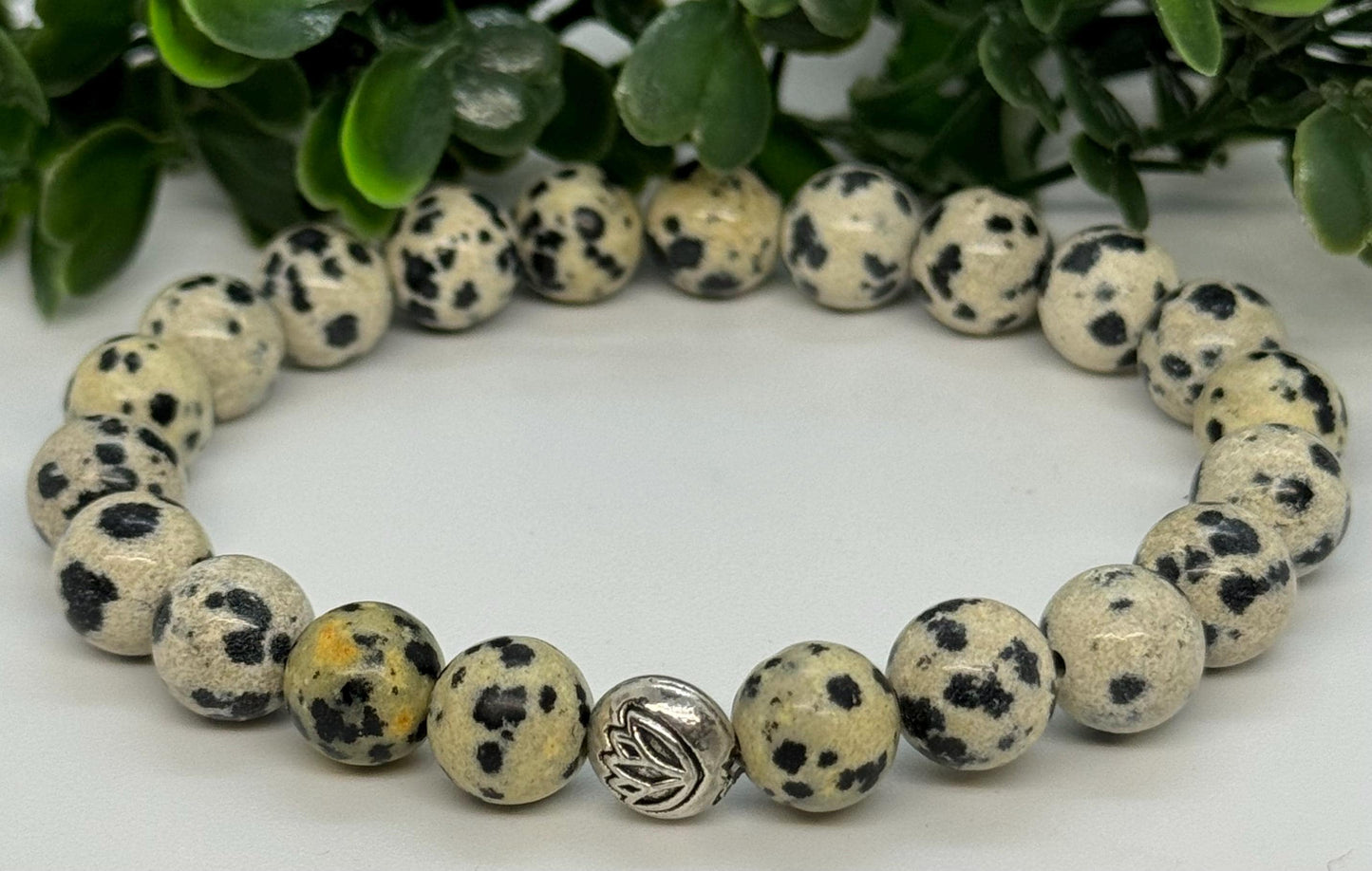 Dalmatian Stone Beaded Stretch Bracelet with a Lotus Silver Bead. Grounding, Protection, Positivity.