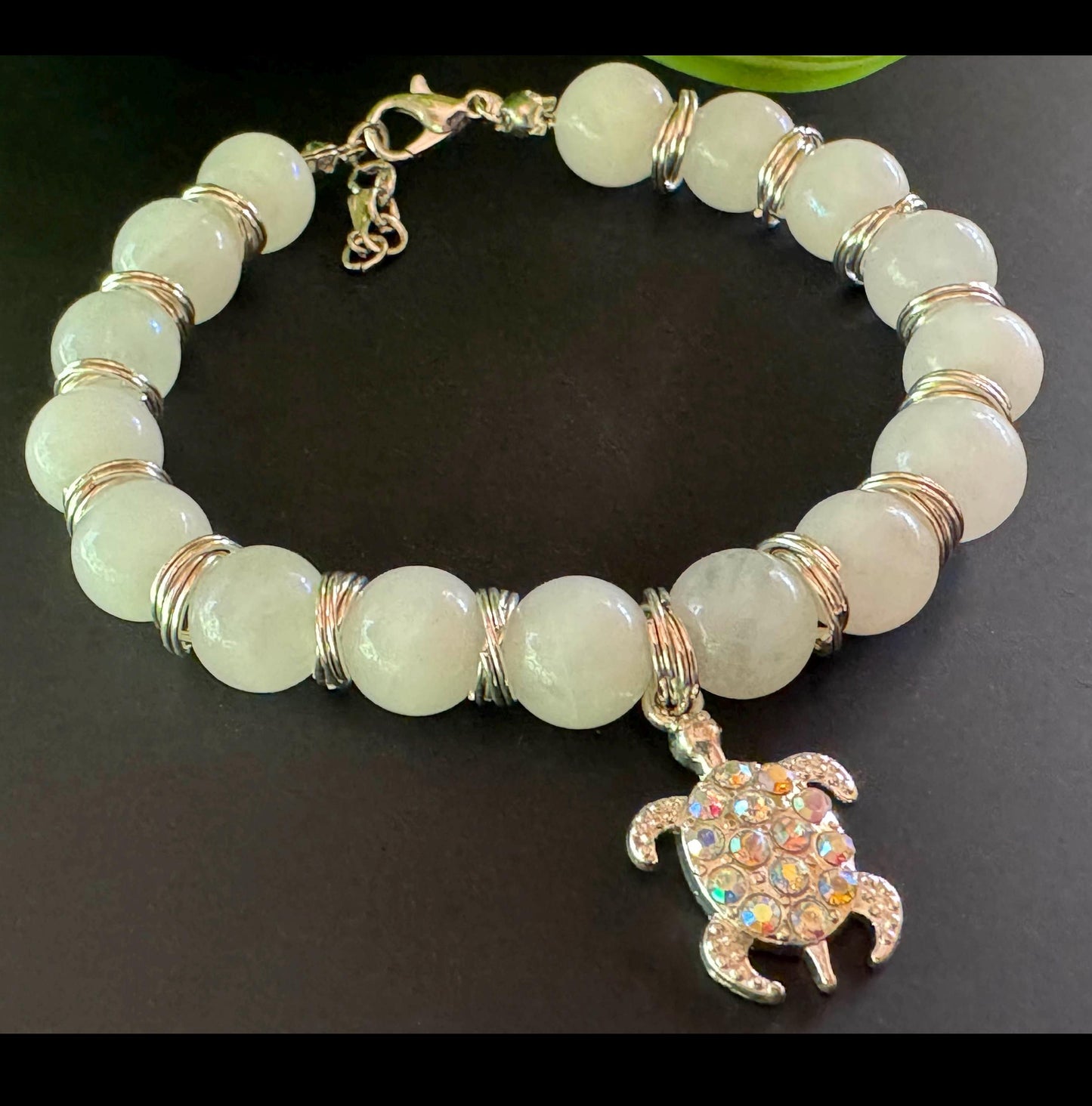 10mm Moonstone Gemstone Bracelet - Moonstone Gemstone bracelet with silver spacers and hanging turtle charm.