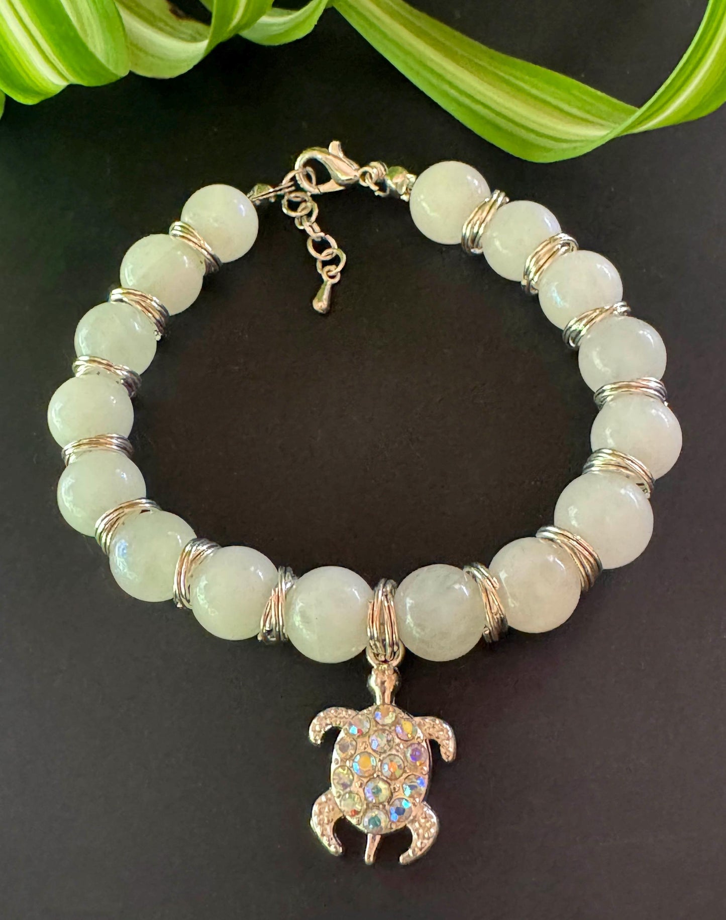 10mm Moonstone Gemstone Bracelet - Moonstone Gemstone bracelet with silver spacers and hanging turtle charm.