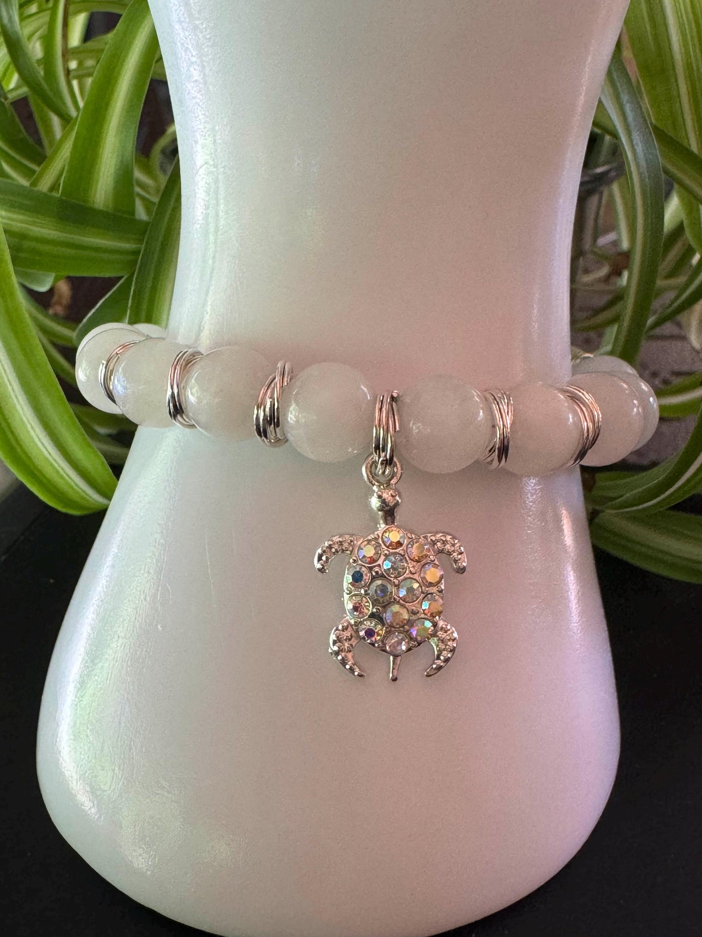 10mm Moonstone Gemstone Bracelet - Moonstone Gemstone bracelet with silver spacers and hanging turtle charm.