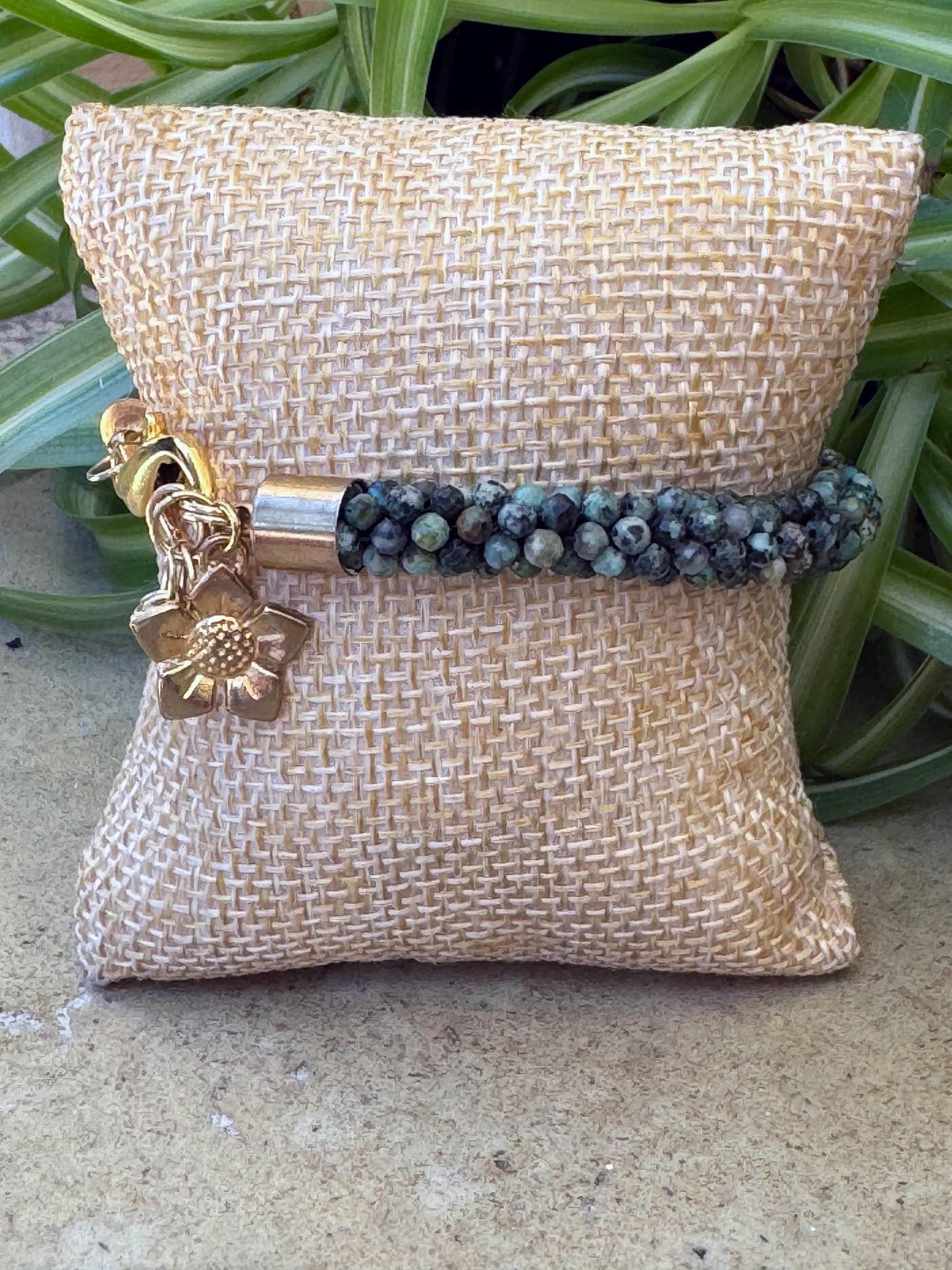 Kumihimo African Turquoise Gemstone Bracelet - African Turquoise Gemstone bracelet with golden flower hanging charm.
