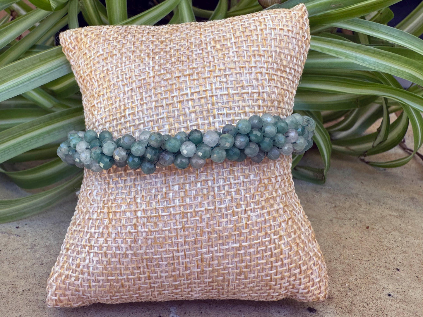 Kumihimo Emerald Gemstone Bracelet - Emerald Gemstone bracelet with golden flower hanging charm.