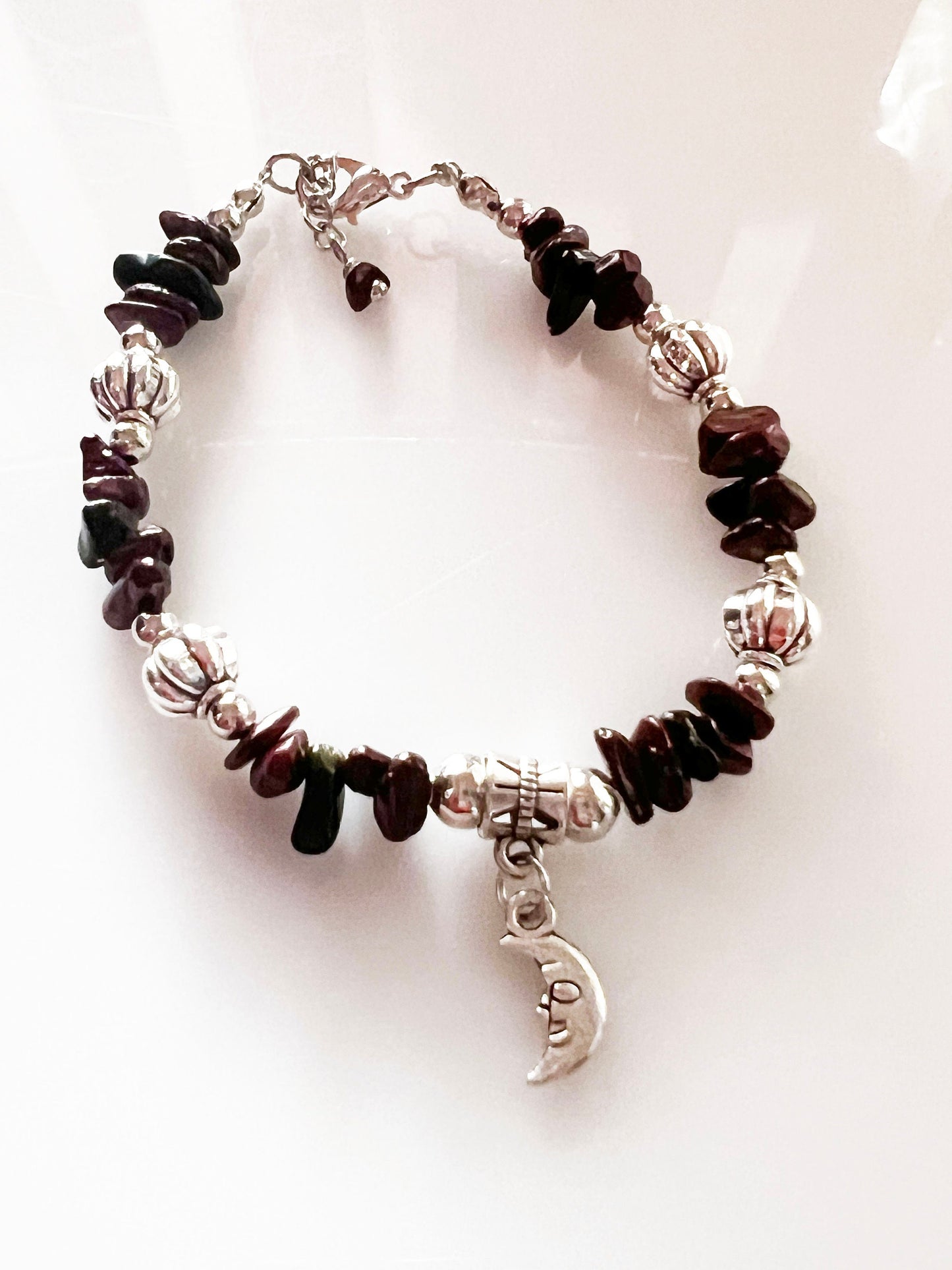 Almandine and Black Onyx Gemstone Bracelet - Almandine and Black Onyx Gemstone bracelet with silver spacers and hanging moon charm.