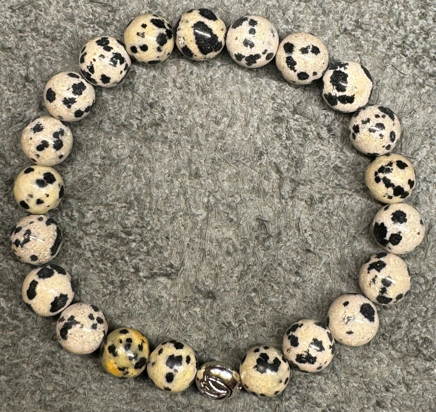 8mm Dalmatian Stone Beaded Stretch Bracelet with a Lotus Silver Bead.