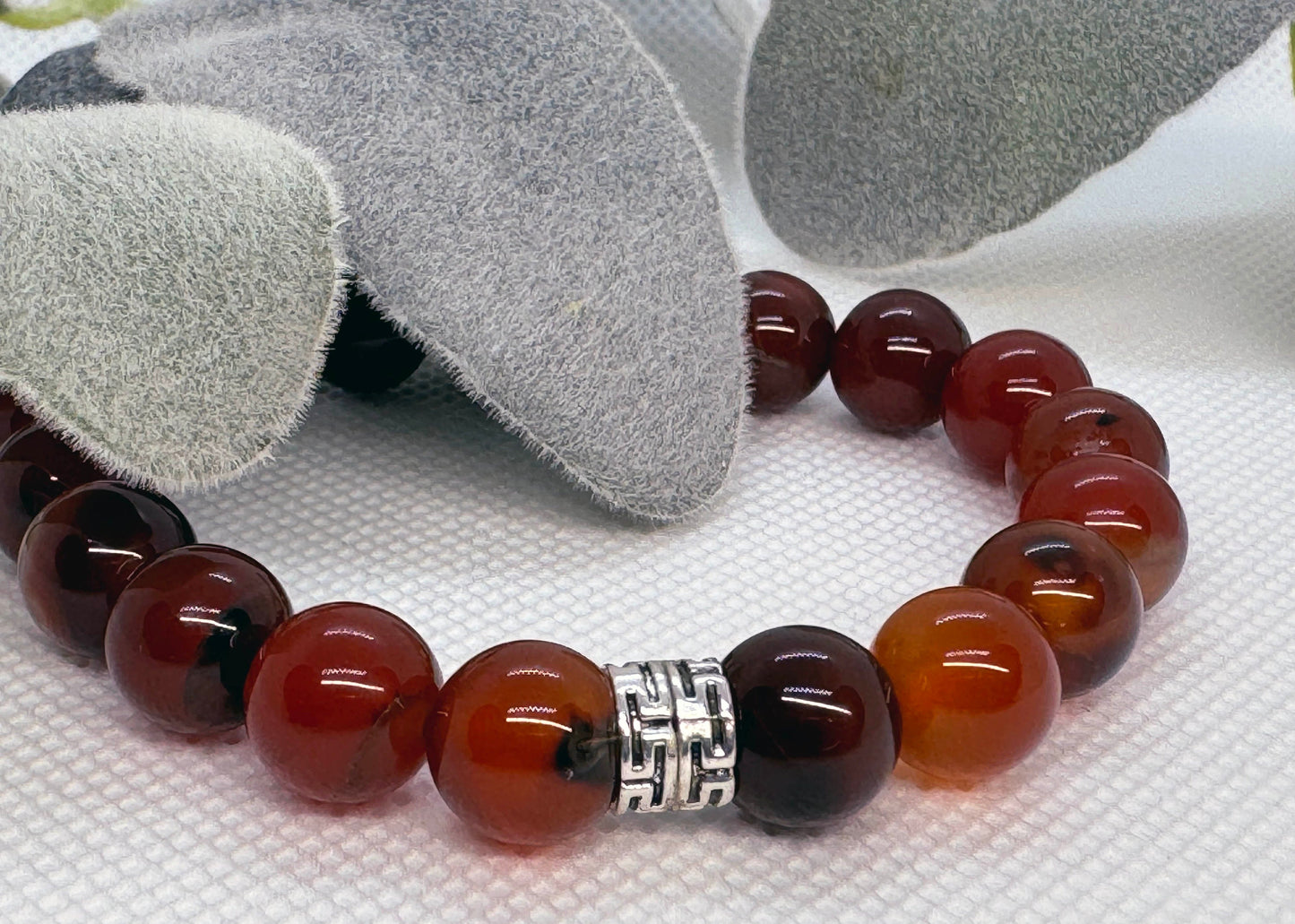 10mm Sardonyx Carnelian Beaded Stretch Bracelet with a Silver Spacer.